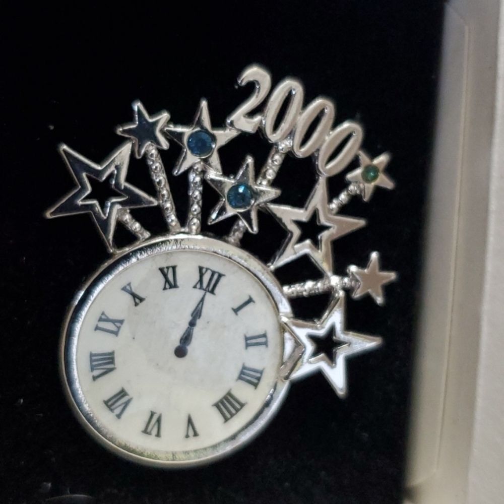 Vintage Avon silver tone millennium brooch